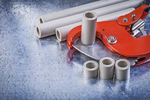Metal Background Studio Shot Drucke: Set of pipe coupling tools on metallic background construction concept