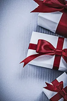 Christmas Present Packaging Drucke: Set of present boxes on white background holidays concept