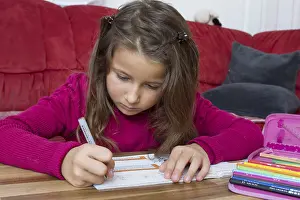 Primary School Homework Drucke: Seven-year-old does schoolwork