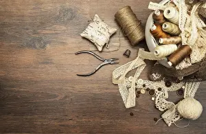 Handicraft Worker Drucke: Sewing concept. Thread spools, buttons and sewing needles