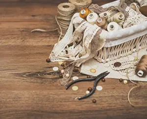 Handicraft Equipment Drucke: Sewing concept. Thread spools, buttons and sewing needles