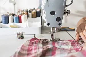 Female Tailor At Work Drucke: Sewing machine close up