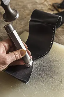Manual Labor Craftsmanship Drucke: Shoemaker, patterns are punched in side part with hole punch and hammer