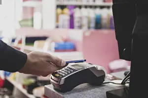 Cashless Transaction Process Drucke: Shopper does payment using smartphone