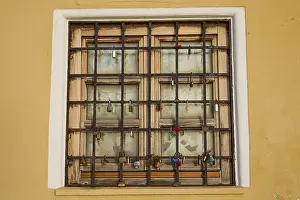 Dodecanese Islands Photography Drucke: A shuttered window with bars in a yellow wall