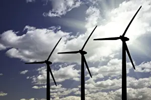 Aviation Industry Images Drucke: Silhouetted wind turbines over dramatic sky and clouds