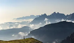 Sexten Dolomites Italy Drucke: Silhouettes of mountains with small clouds in between