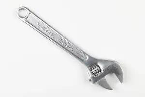 Bright Background Copy Space Drucke: A silver adjustable wrench on a white background