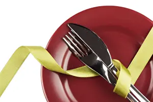 Simple Table Setting Drucke: Simple table setting with green ribbon on white background