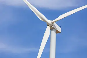 Power Generation Drucke: Single wind turbine over dramatic blue sky