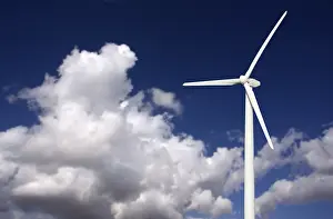 Wind Turbine Landscape Drucke: Single wind turbine over dramatic blue sky and clouds