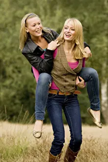 Outdoor Portrait Photography Drucke: Two sisters in a park having fun