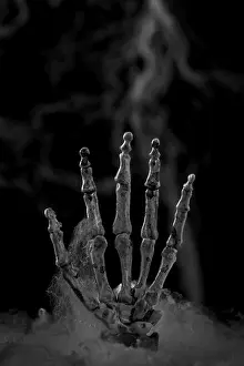 Traditional Halloween Decor Drucke: Skeleton hand in front of artificial cobwebs