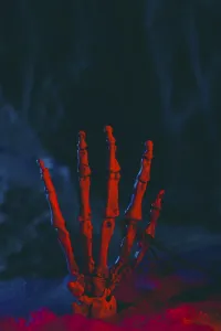 Spider Web Design Drucke: Skeleton hand in front of artificial cobwebs