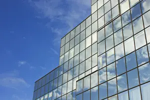 Highrise Construction Photography Drucke: Sky and skyscraper building with reflection of sky and clouds