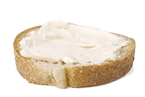 Bread And Dairy Products Drucke: Slice of bread with cheese cream spread on it