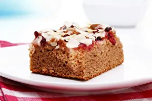 Cranberry Dessert Drucke: Slice of nut cake with almonds and cranberries