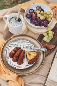 Fresh Fruit And Vegetable Display Drucke: A slice of pumpkin cake is artfully plated with a fork on a rustic dish