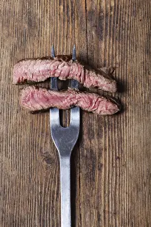 Grocery Store Food Pics Drucke: Slice a steak onto a meat fork