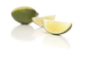 Healthy Food Images Drucke: Sliced lime on a reflective white surface
