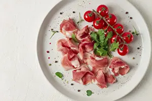 Emilia Romagna Cuisine Drucke: Sliced prosciutto, appetizer, with cherry tomatoes