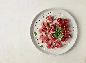 Emilia Romagna Cuisine Drucke: Sliced prosciutto, appetizer, with cherry tomatoes