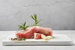 Low Angle View Drucke: Slices of pork escalope on the table