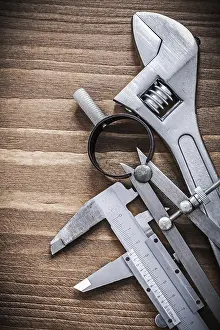 Detail View Of Tools Drucke: Slide caliper pair of compasses adjustable spanner construction concept