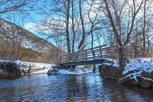 Deserted Waterfront Europe Drucke: Small bridge over stream, Winter