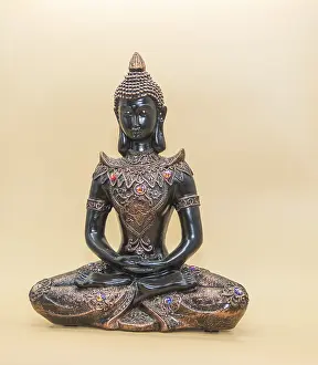 Buddhist Figure Drucke: Small buddha image isolated on light background