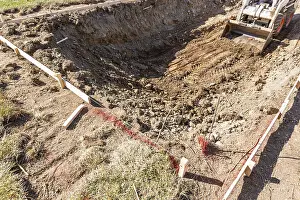 Bulldozer Construction Site Drucke: Small bulldozer digging in yard for pool installation