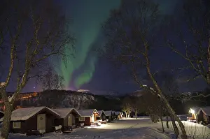 Nocturnal Landscape Photography Drucke: Small cabins in wintry landscape