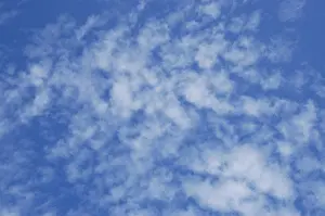 Cloudy Blue Skies Drucke: Small clouds in a blue sky