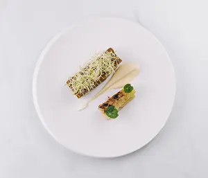 Minimalist Food Photography Drucke: Two small courses are presented on a white plate