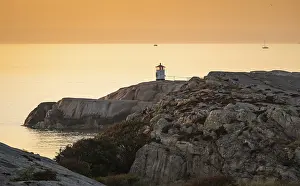 Lighthouse In The Evening Sun Drucke: Small lighthouse at sunset, archipelago
