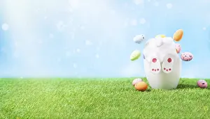 Easter Bunny Drucke: A small rabbit rummages in a pot of Easter eggs