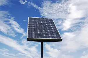Solar Cell Technology Drucke: Small Solar Panel against a cloudy blue sky