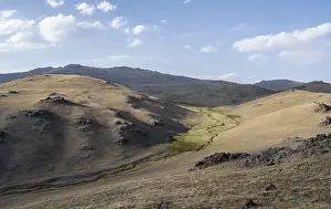 Uninhabited Water Body Drucke: Small stream between mountainous hills