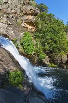 Eroded Rock Formation Europe Drucke: A small waterfall flowing over rocks