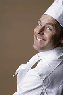 Chef Portrait Drucke: Smiling cook, looking over the shoulder