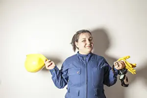 Female Construction Worker Drucke: Smiling female worker dressed in work clothes