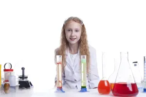 Female Researcher Drucke: Smiling little experimenter looking at camera