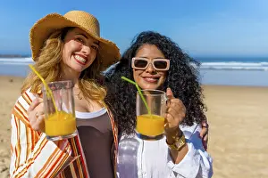 Sandy Beach Scenery Drucke: Two smiling women posing for the camera
