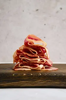 Smoked Food Images Drucke: Smoked bacon pieces stacked in a stack