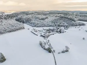 Southern Germany Forest Scenery Drucke: Snow-covered fields and forests under a twilight sky