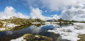 Mountainous Coastal Region Drucke: Snow on summit of Key Summit, Reflection of Mt