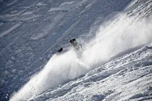 Athletic Male Drucke: A snowboarder in action