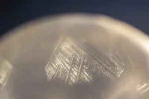 Frozen Soap Bubble Drucke: Detail of a soap bubble frozen