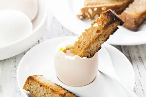 Toasted Bread Breakfast Drucke: The soft-boiled egg in an eggcup with toasted bread