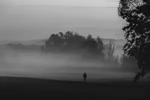 Dense Fog Atmosphere Drucke: Solitude theme image with the silhouette of a man